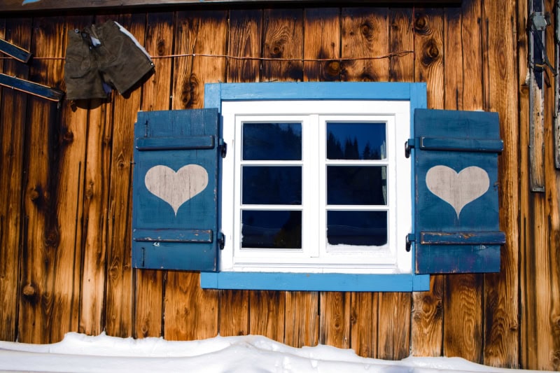 Protect Your Plumbing From Freezing Weather. Snow outside of a house.