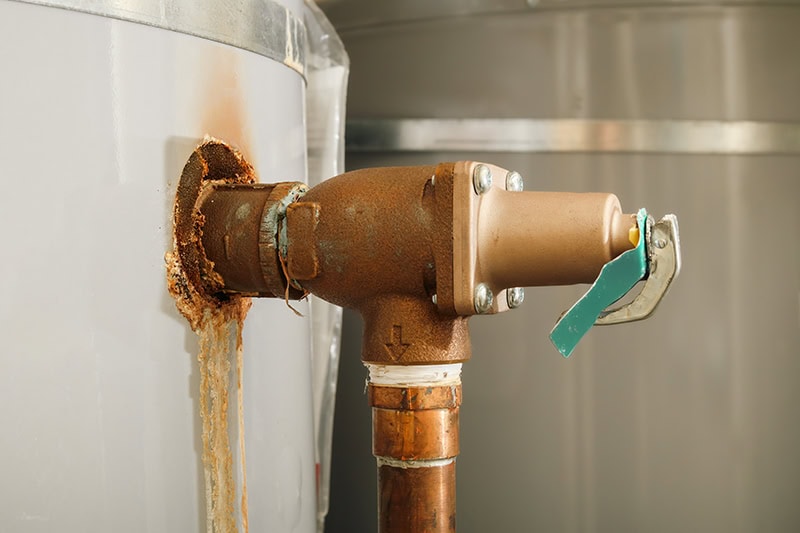 Rusted pipes on a water heater.